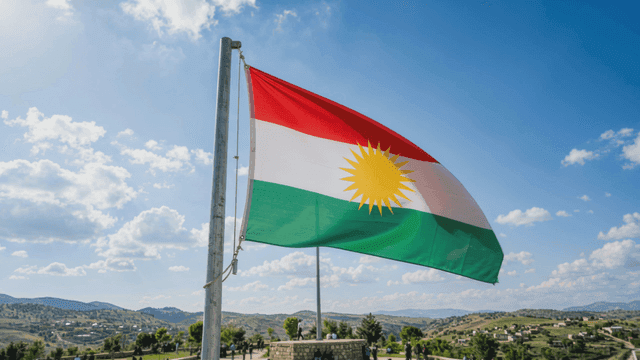 Kurdistan flag fluttering amidst beautiful scenery