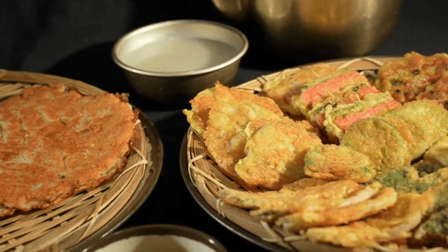 Assorted Korean pancakes on a wicker tray