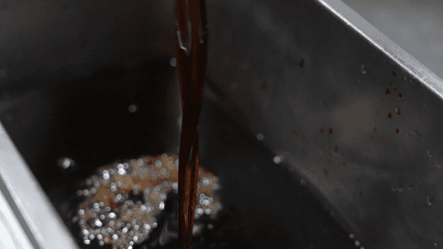 Ladle for pouring dark soy sauce into container
