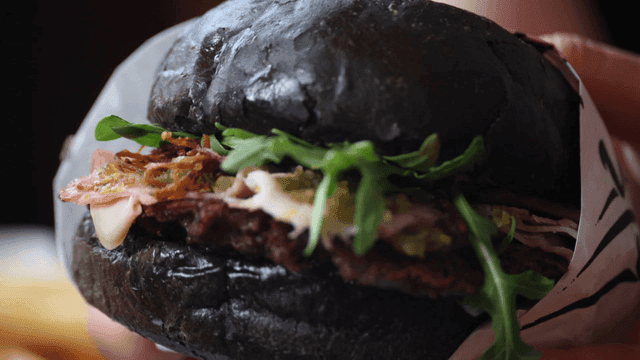 Black burger with fresh ingredients