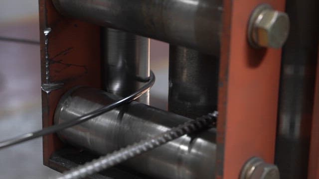 Metal wire being processed in a factory