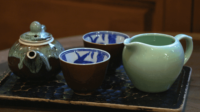 Set of traditional teacups on tray