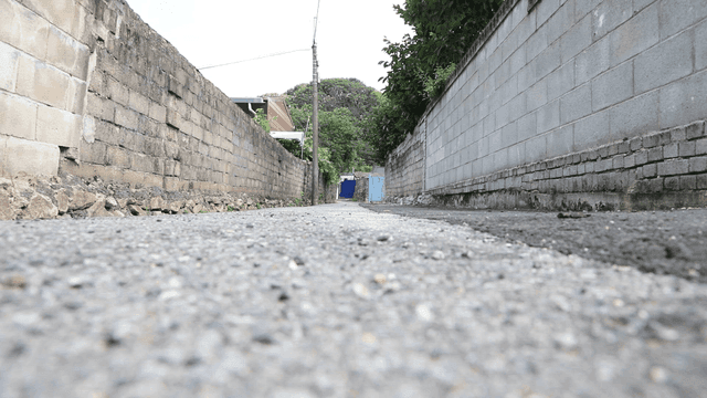 Narrow alleyway between brick walls