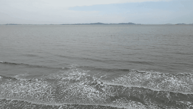 A calm beach with gentle waves