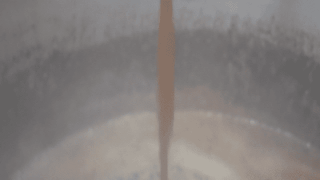 Hot soy sauce broth poured into pot