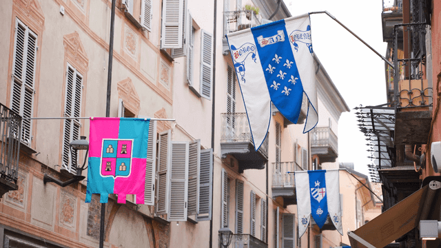 Colorful flags on narrow European street