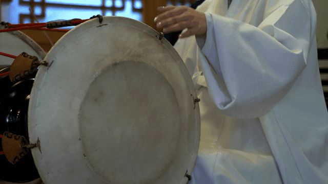 Woman performing traditional Korean janggu