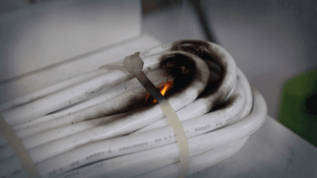 Burning electrical cables with smoke