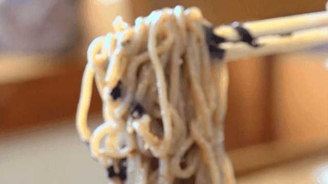 Perilla oil buckwheat noodles lifted with chopsticks