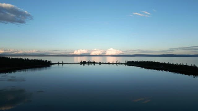 Tranquil lake reflecting the sky