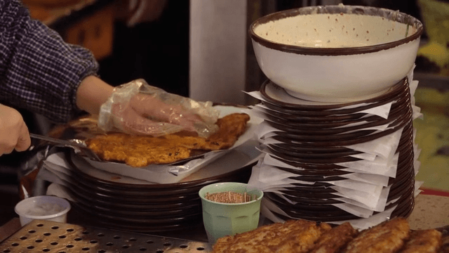 Mung bean pancakes served in bowl at restaurant