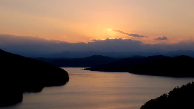 Sunset over a serene mountain lake