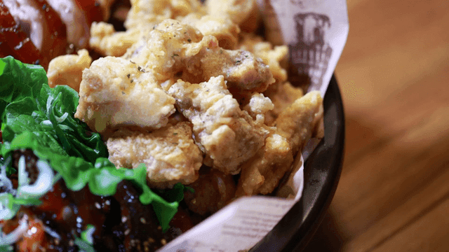 Crispy fried chicken with fresh greens