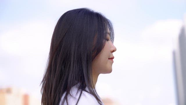 Woman smiling outdoors in the city