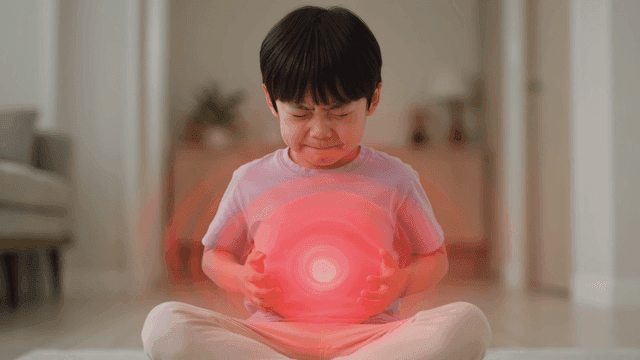 Boy feeling stomach pain at home