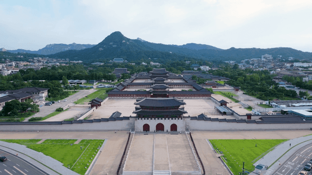 Historic palace with mountains in the background