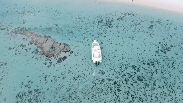 Yacht on clear turquoise waters