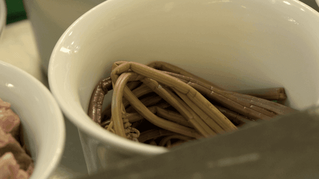 Fresh bracken in a white bowl