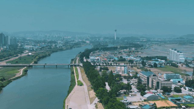 River cutting through city landscape.