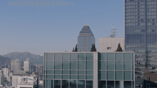 City skyline with mountains in the background