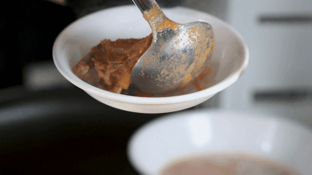 Soybean curd and potato stew, pork backbones scooped up with ladle