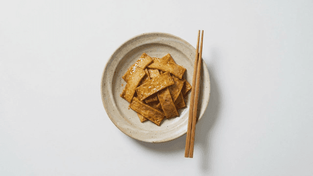 Stir-fried fish cake and chopsticks