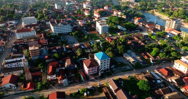 Aerial View of a Bustling Town at Sunrise