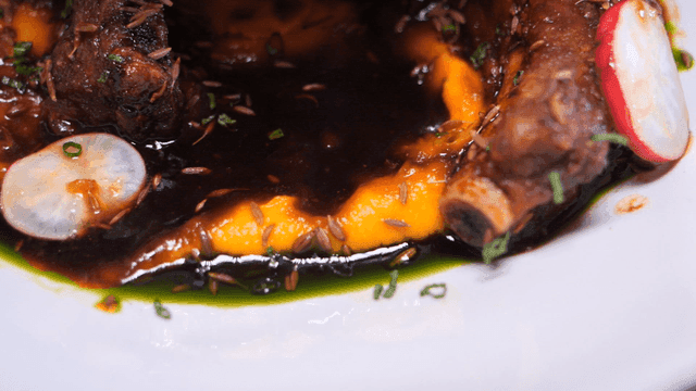 Ribs in rich sauce with garnish