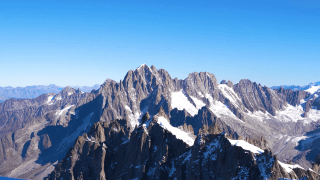 Snow-capped mountain peaks under a clear sky
