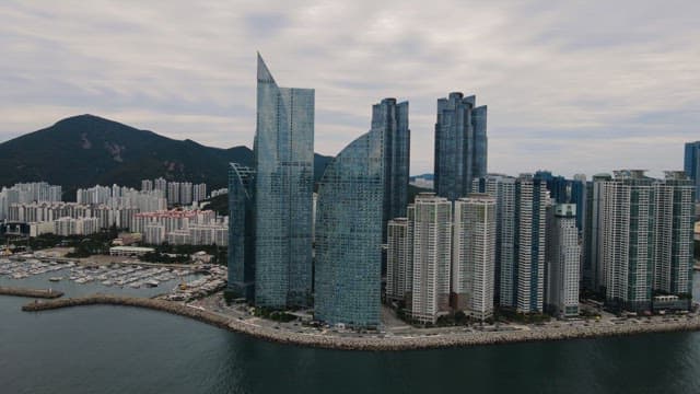 Aerial view of modern skyscrapers by the sea