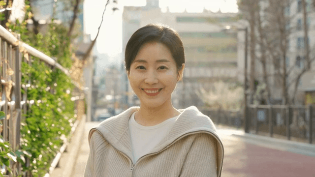 Woman smiling on a sunny street