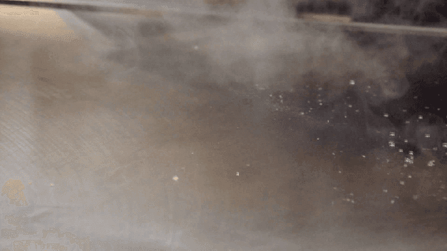 Steam rising from a hot griddle