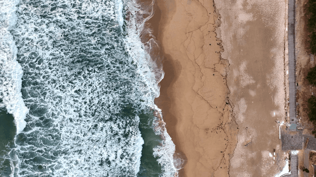 Waves crashing on a sandy beach