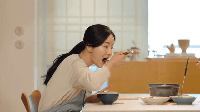 Woman eating at home