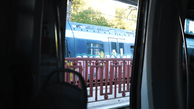 View of a train passing by from inside