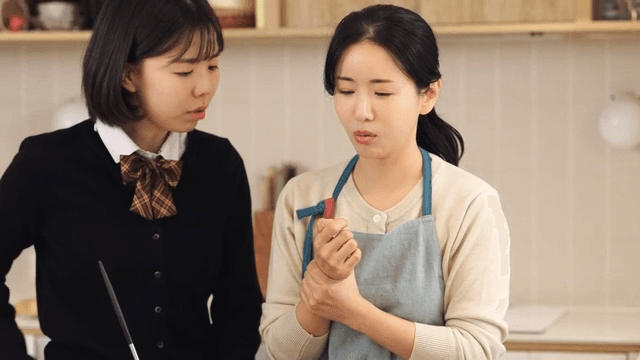 Daughter worried about mom's wrist pain in kitchen