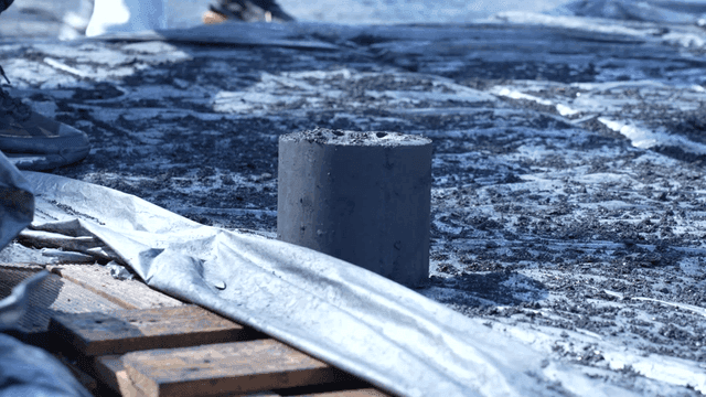 Volunteers carrying briquettes