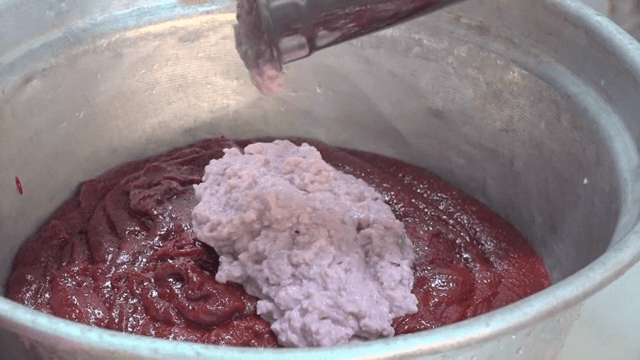 Mixing ingredients in a large pot