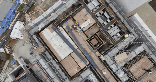 Construction site with workers and materials