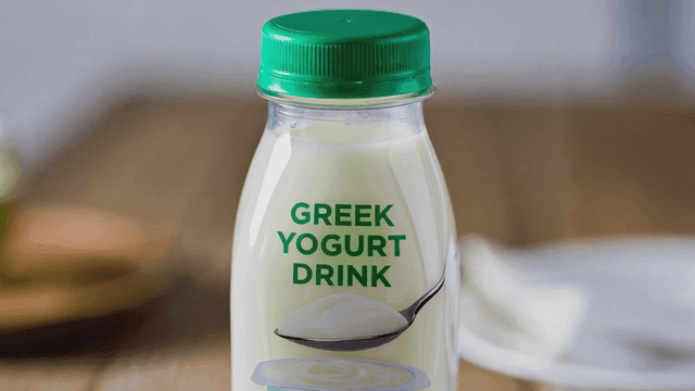 Greek yogurt drink placed on table