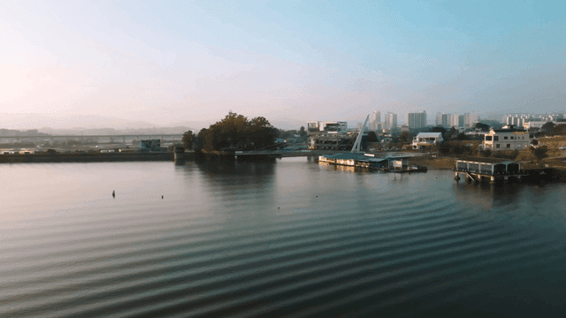 Sunrise view of quiet riverside city at dawn