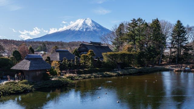 Traditional village with Mount Fuji in the background