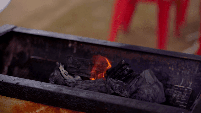 Charcoal burning in a grill