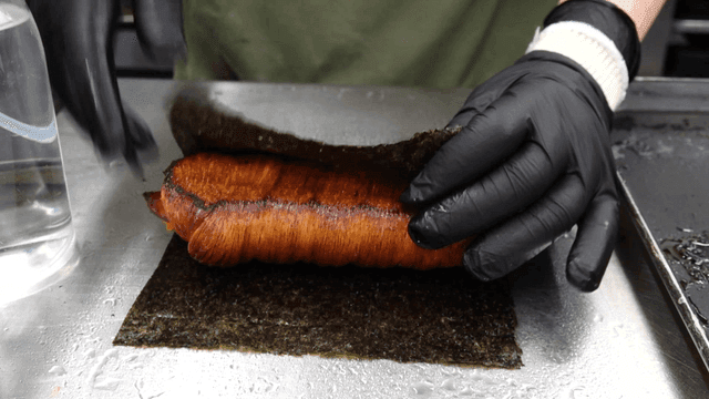 Wide seaweed wrapping well-baked bread