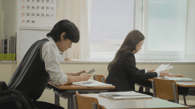 Student using a smartphone in the classroom