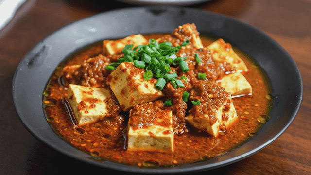 Mapo tofu with spicy sauce and green onions