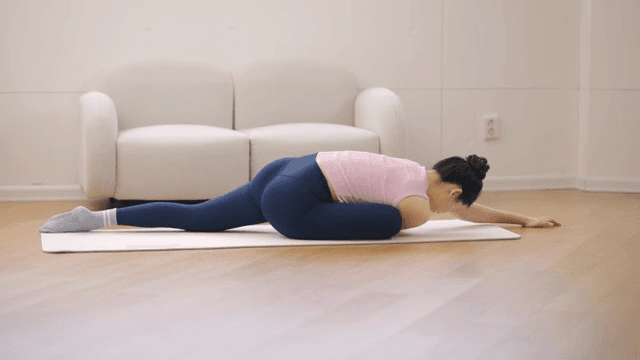 Woman practicing yoga indoors