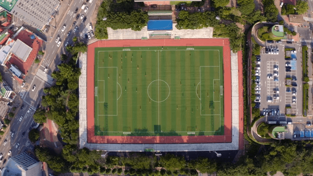 Aerial view of a soccer field in the city