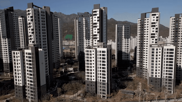Modern high-rise apartments with mountains