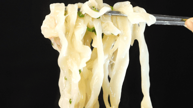 Chicken kalguksu lifted with chopsticks